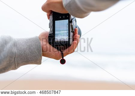 Traveller Make Photo Using Mirrorless Camera In Hand, Travel Blogger, Close Up Of Mens Hands Holding