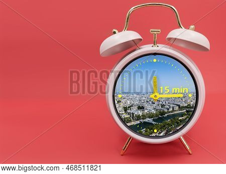 Ringing Twin Bell Vintage Classic Alarm Clock Isolated On Red And With The 15 Minute City Concept.