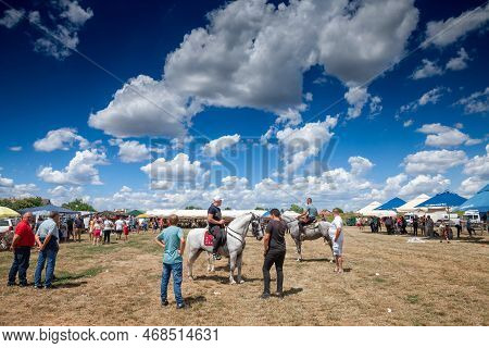 Ruma, Serbia - June 26, 2022: Selective Blur On Three Horseriders, Serbian Young Men, Riding Horses 