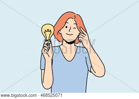 Smiling Young Woman With Lightbulb In Hand Develop Creative Idea. Happy Female With Light Bulb Gener