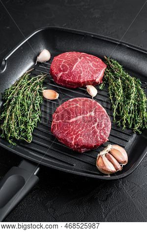 Tenderloin Raw Fillet Mignon Beef Steaks On A Pan. Black Background. Top View.
