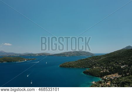Popular Tourist Destination. Bay With Boats On Lefkada Island. Nydri Village.