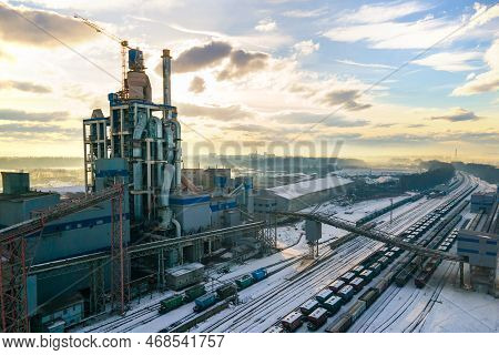 Aerial View Of Cement Plant With High Factory Structure At Industrial Production Area.