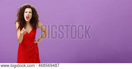 Woman In Fury Fighting With Husband Over Money Making Italian Gesture With Fingers Shouting And Yell