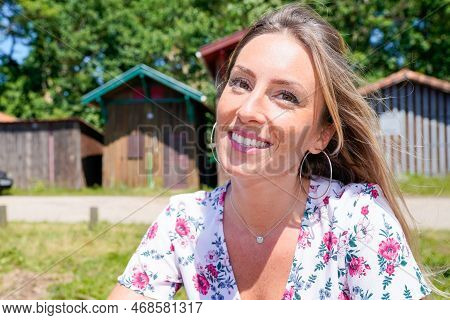 Beautiful Blonde Woman Front Of Fisherman Wooden Hut In Arcachon Bay France