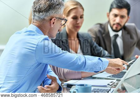 Business Team Discussing Something While Sitting At An Office De