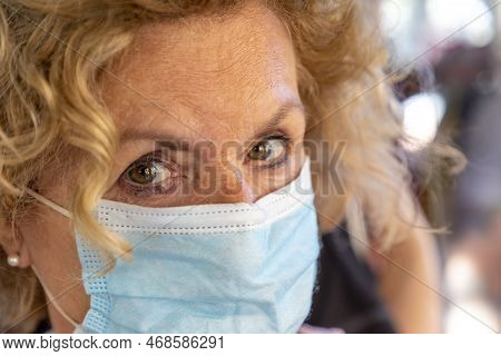 Attractive Woman Wears A Ffp2 Medical Mask Which Is Also Licensed For Medical Operations