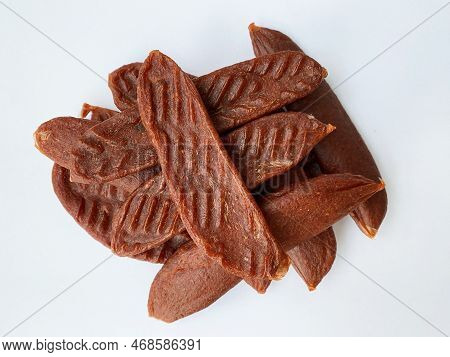 Dry Salmon Or Cod Roe Caviar Sticks On White Background. Dried Fish Snacks For Beer.