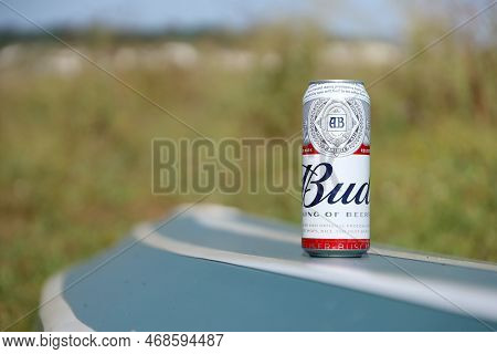 Sumy, Ukraine - August 01, 2021: Can Of Budweiser Lager Alcohol Beer On Overturned Kayak Boat Outdoo