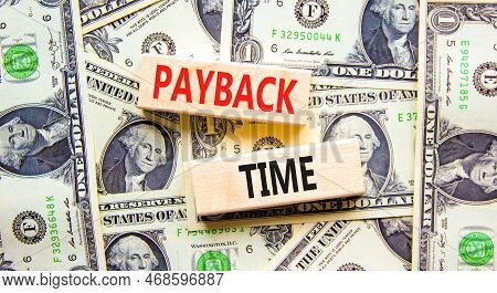 Payback Time Symbol. Concept Words Payback Time On Wooden Blocks. Beautiful Background From Dollar B