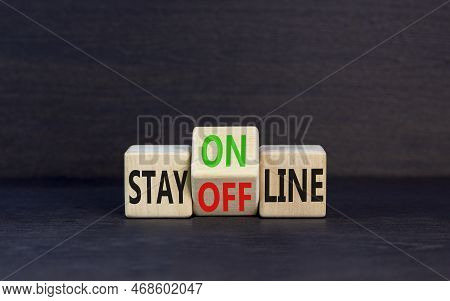 Stay Online Or Offline Symbol. Concept Word Stay Online Or Offline On Wooden Cubes. Beautiful Black 