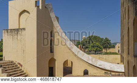 A Fragment Of The World's Largest Ancient Sundial Samrat Yantra On A Blue Sky Background. The Walls,