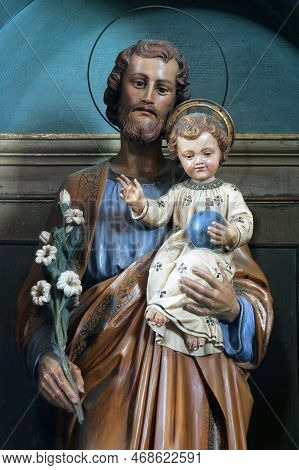 Karlovac, Croatia - July 06, 2012: St. Joseph Holding The Child Jesus, Statue On The Altar Of St. Jo