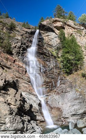 Contrast Streams Of Mountain Alpine Lillaz Waterfall (cascate Di Lillaz) Rush Down Granite Rapids To