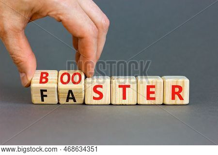 Booster And Faster Symbol. Concept Word Booster Faster On Wooden Cubes. Businessman Hand. Beautiful 