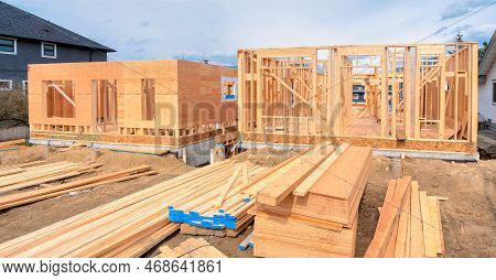 Wooden Frame Of Two New Houses With Engineered Lumber Materials In Front