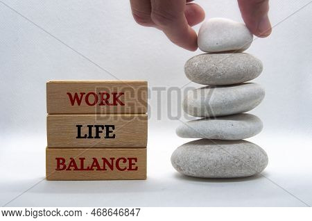 Work Life Balance Text On Wooden Blocks With Balanced White Stones Background. New Ways Of Working C