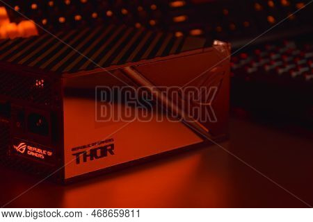 Computer Ac Power Supply Asus Rog Thor 1000W On A Dark Background.