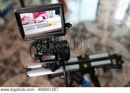 Digital Camera With External Monitor On Camera Slider Filming Woman Typing On Keyboard. Professional