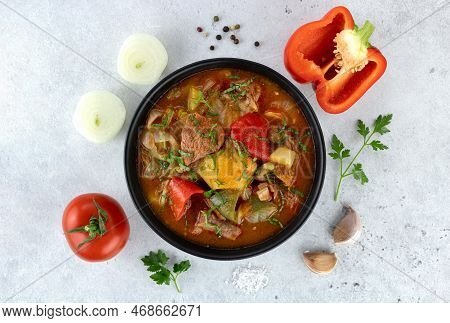 Georgian Or Armenian Meat Khashlama With Ingredients For Cooking On A Gray Background. Top View.