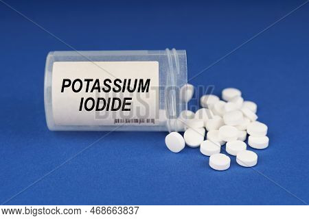 The Concept Of Pharmacology And Health. On A Blue Surface Are Pills And A Dusty Jar With The Inscrip