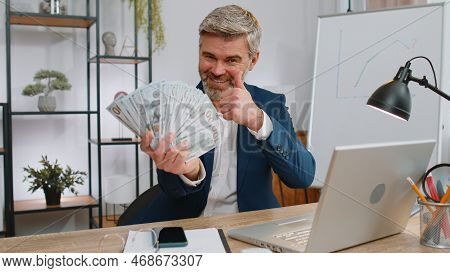 Rich Pleased Boss Middle Aged Businessman Waving Money Dollar Cash Banknotes Bills Like A Fan Succes