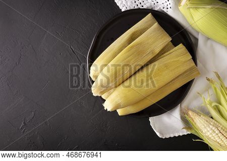 Tamales De Elote, Also Called Uchepos. Typical Mexican Dish. Can Be Served With Green Salsa And Acco