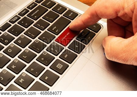 Computer Keyboard With Red Block Advertisements Key