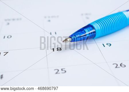 Blue Pen On Calendar Page Background Business Planning Appointment Meeting Concept