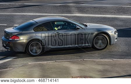 Side View Of Gray Coupe Bmw M6 In Motion. Bmw M6 E63 Car Drive On The Street. Moscow, Russia - Augus