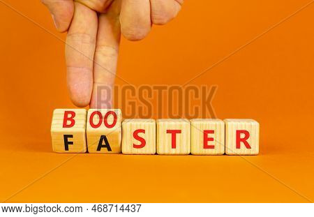 Booster And Faster Symbol. Concept Word Booster Faster On Wooden Cubes. Businessman Hand. Beautiful 