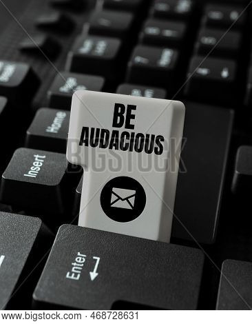 Handwriting Text Be Audacious. Conceptual Photo Takes Risks In Order To Achieve Something Unconventi