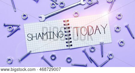 Hand Writing Sign Shaming. Word Written On Subjecting Someone To Disgrace, Humiliation, Or Disrepute