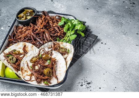 Cooking Of Mexican Lamb Barbacoa Tacos With Cilantro And Onion. Gray Background. Top View. Copy Spac
