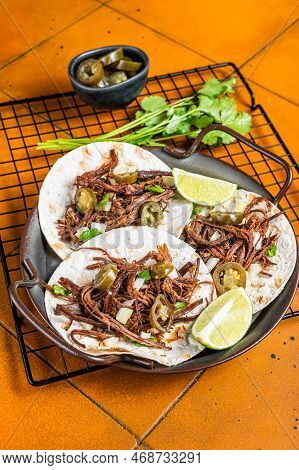 Beef Barbacoa Tacos With Cilantro And Onion. Orange Background. Top View