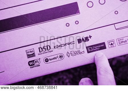 Paris, France - Dec 13, 2022: Pov Male Hand Pointing To Chromecast Built-in, Certified Sign On New O
