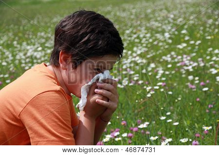 Allergic Boy To Pollen And Flowers With A Handkerchief While Sneeze In The Middle Of The Minesweeper