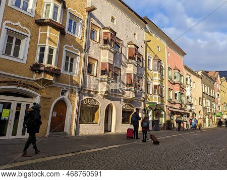 Vipiteno, Italy - December 30, 2022: Sunny Day Od December On Colored Ad Picturesque Street Of Vipit