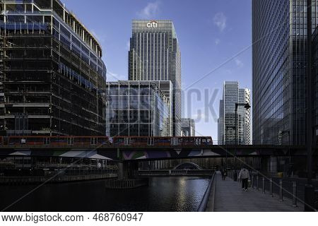 London - 01 26 2022: Wide Shot On An Elevated Subway Line With Skyscrapers, People And Trees In The 