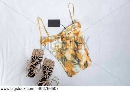Multi-colored Top Or Corset On Thin Straps With Bones And Beige Toeless Shoes On White Background. B