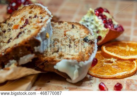 Christmas Stollen With Candied Fruit And Dried Fruits On Parchment. Stollen - Traditional German Bre