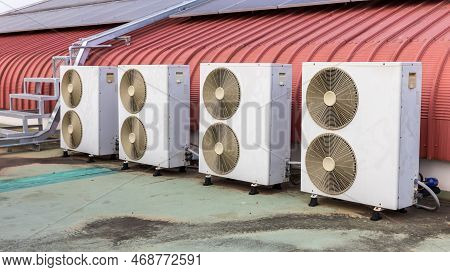 Air Conditioner Compressor Installed In Old Building. Outdoor Split Wall Type Air Conditioner Compre