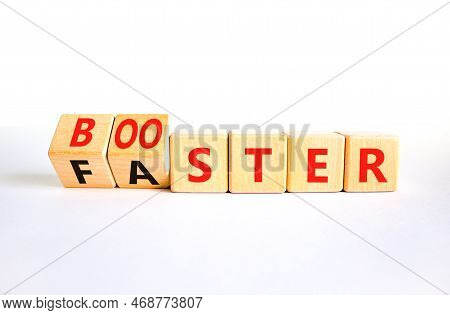Booster And Faster Symbol. Concept Word Booster Faster On Wooden Cubes. Beautiful White Table White 