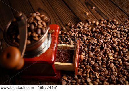 A Coffee Grinder And Coffee Background A