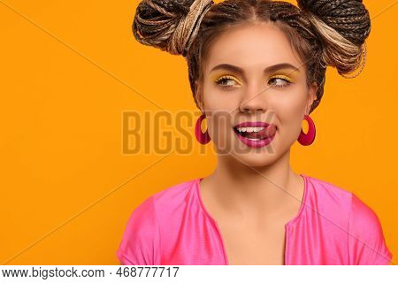 Beautiful Woman With Braided Double Buns On Yellow Background, Space For Text
