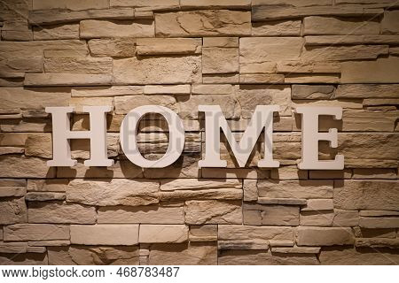 On A Wall Covered With Narrow Stones, The Word 