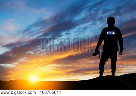 Photojournalist Silhouette Documenting War Or Conflict. Photojournalist At Sunset. War, Army, Techno