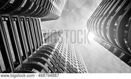 The Narrow Passage Between Modern Residential Buildings. Walls Of High-rise Apartment Buildings And 
