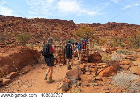 Twyfelfontein, Damaraland, Namibia - 05 October 2018: Tourists In Twyfelfontein, Site Of Ancient Roc