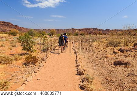 Twyfelfontein, Damaraland, Namibia - 05 October 2018: Tourists In Twyfelfontein, Site Of Ancient Roc